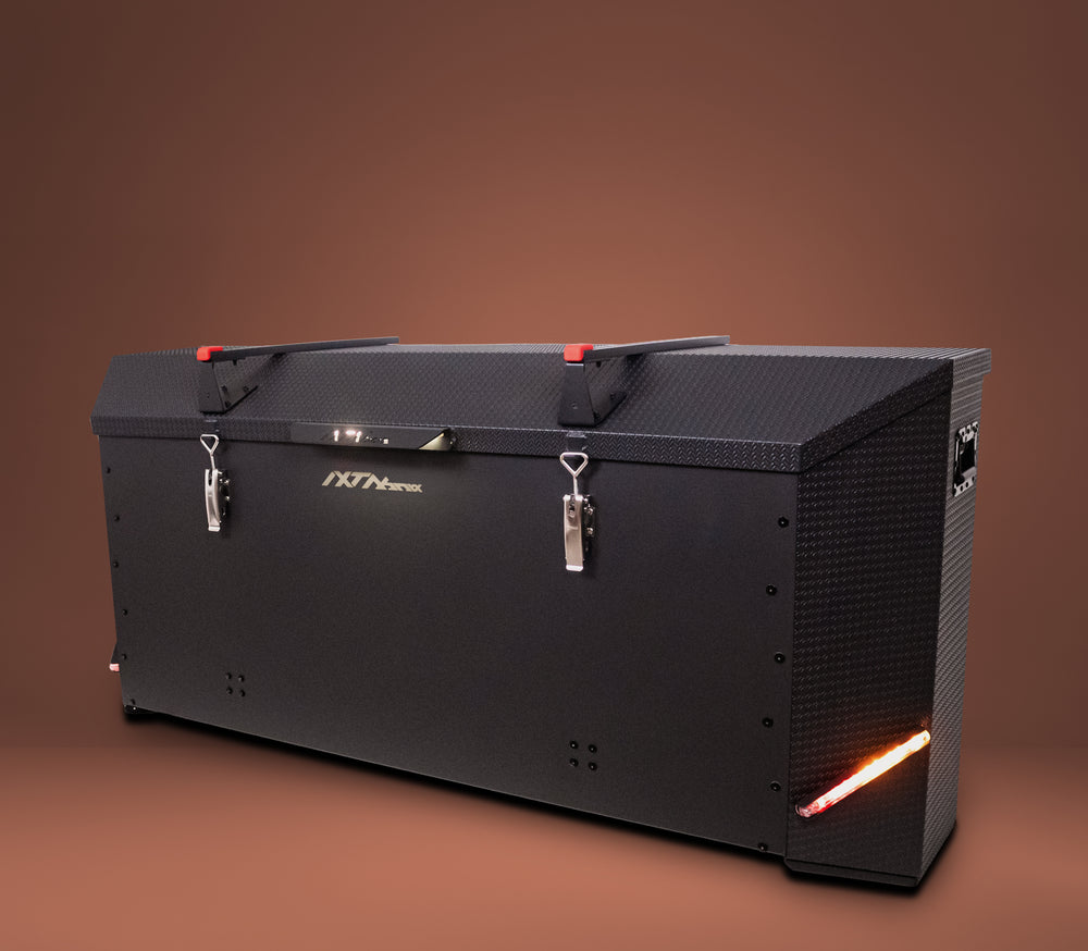 IXTAbox Caravan 700L cargo box mounted on caravan, black finish, side view, led lights